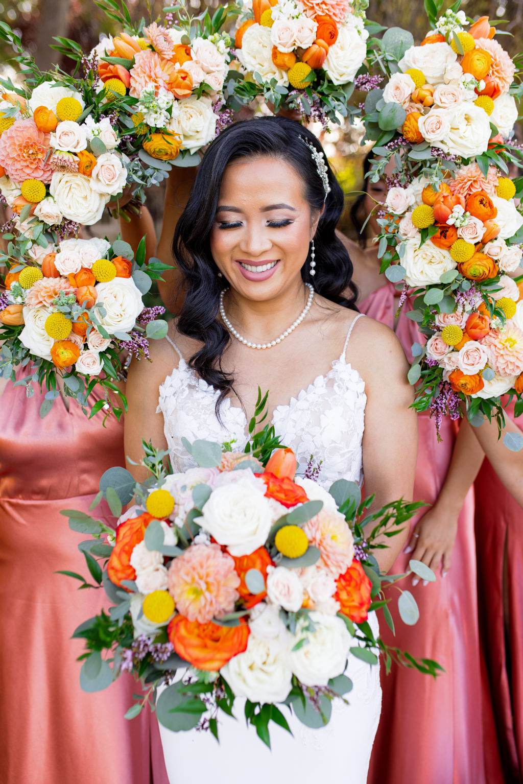Bride relaxed and happy in the flowers at her Catta verdera wedding